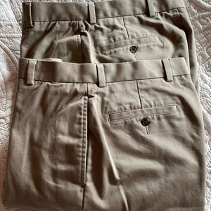 Two identical pairs of men’s pants.